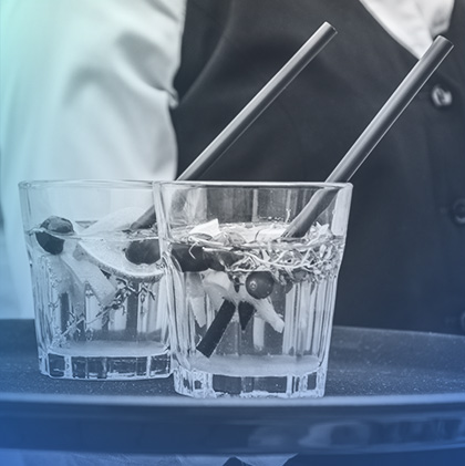 Waitress carrying tray with glasses